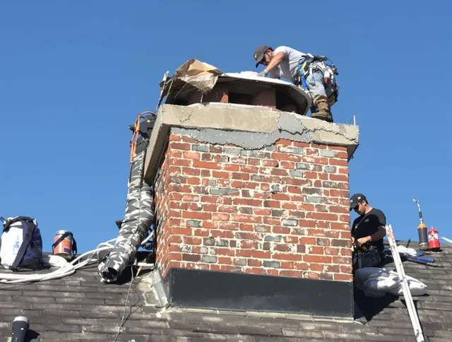 Ridgefield Chimney Sweep installing a custom chimney crown in Ridgefield, CT
