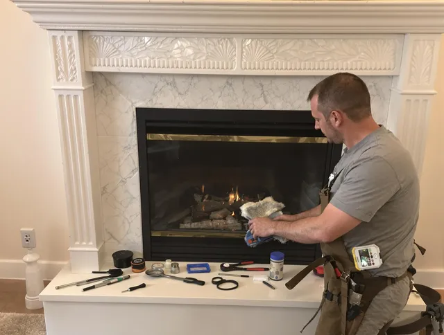 Ridgefield Chimney Sweep performing fireplace maintenance in Ridgefield, CT
